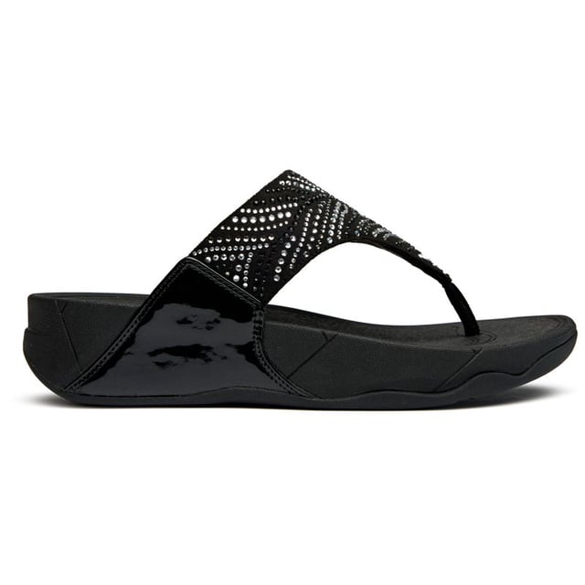 Sandalias Fitflop Lulu Cristal Pluma Estas no son tus sandalias promedio. La Lulu Crystal Feather eleva la comodidad casual con detalles de cristal que brillan y capturan la luz maravillosamente. Construidas sobre la suela micro wobbleboard característica de FitFlop, ofrecen soporte ergonómico mientras que el tacón de 4 cm añade un sutil aumento de altura. Las elegantes correas sintéticas negras ofrecen durabilidad y estilo que se adaptan sin esfuerzo desde la piscina hasta paseos nocturnos.
