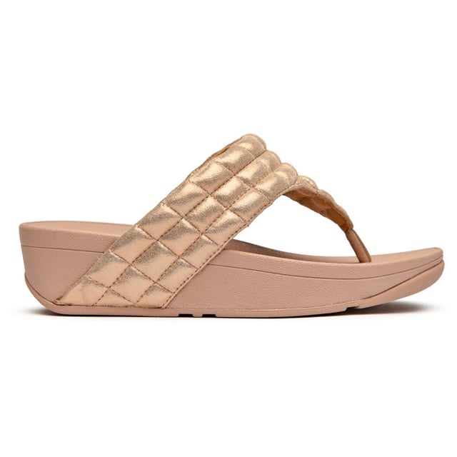 Fitflop Lulu Padded Shimmy Sandals Shimmer your way through summer in these luxuriously padded flip flops that prove comfort and glamour can coexist beautifully. The soft pink synthetic upper cradles your feet while the innovative micro wobbleboard sole works to tone and engage your muscles with every step. At 4cm, these elevated sandals add just the right amount of lift without sacrificing the legendary Fitflop comfort that keeps you walking in blissful ease all day long.