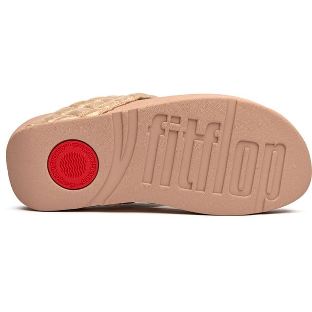 Fitflop Lulu Padded Shimmy Sandals Shimmer your way through summer in these luxuriously padded flip flops that prove comfort and glamour can coexist beautifully. The soft pink synthetic upper cradles your feet while the innovative micro wobbleboard sole works to tone and engage your muscles with every step. At 4cm, these elevated sandals add just the right amount of lift without sacrificing the legendary Fitflop comfort that keeps you walking in blissful ease all day long.