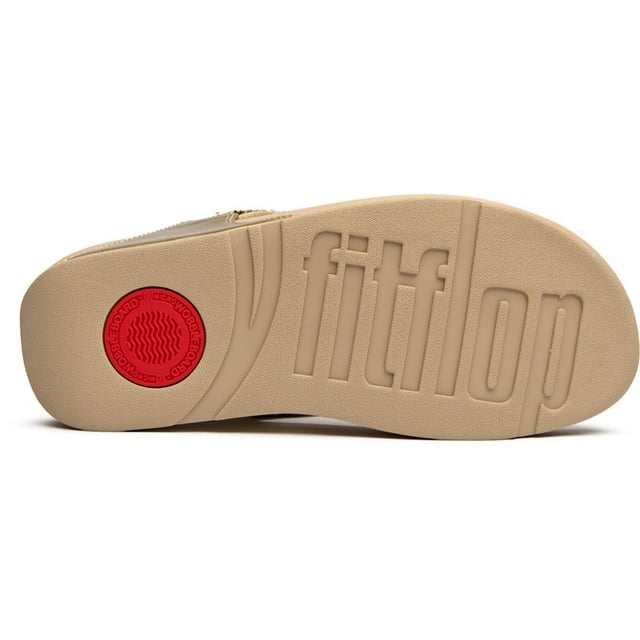 The Fitflop Lulu Shimmerfoil brings glamour to your everyday stride with its eye-catching metallic finish that catches the light beautifully. These sophisticated flip flops feature Fitflop's signature micro wobbleboard sole technology, delivering exceptional comfort and support with every step. The 4cm heel adds a subtle lift while the shimmering synthetic upper creates an effortlessly chic look that transitions seamlessly from poolside to pavement.