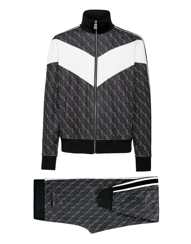 Peppen Sie Ihr Trainingsoutfit mit diesem Fleece-Jogginganzug aus Baumwollmischung mit Log-Print auf. Das Set ist mit Farbblockeffekten und gestreiften Seitenbändern verziert. Die Sweatjacke mit Reißverschluss hat zwei Eingrifftaschen. Die Hose hat einen Kordelzug in der Taille, zwei Taschen auf der Vorderseite und eine mit Schlitz auf der Rückseite. Säume aus Rippstrick.