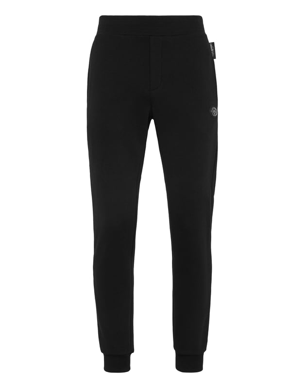 These joggers are the perfect match to achieve your goals. Comfort and performance add up to the style of Plein Sport.   Cotton fleece   Rubberized Tiger patch sewn on the left leg   Patches with lettering sewn on the back of left leg   Elasticated waistband    Two slit pockets   Loose fit for greater comfort   Rib knit bottom cuffs