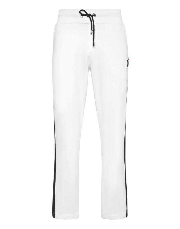 Eleva tu colección de ropa de estar por casa con estos lujosos pantalones de chándal, diseñados para ofrecer una comodidad refinada y un estilo contemporáneo. Confeccionados en algodón de primera calidad, aportan un toque sofisticado al estilo casual.    Confección en lujoso algodón que garantiza un tacto suave y transpirable.   Silueta entallada para un ajuste moderno y elegante.   Cintura elástica con cordón para una comodidad personalizada.   Los puños acanalados añaden un toque refinado a la silueta atlética.   Perfectos para combinar con una sudadera con capucha a juego o una camiseta informal.