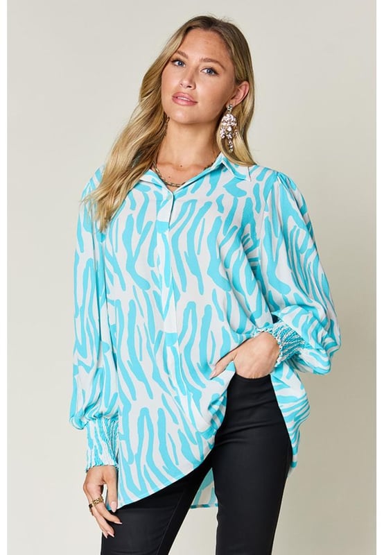 Ruched and smocked design
  Pullover closure
  Opaque fabric
  No stretch
  100% polyester
  Machine wash cold
  Tumble dry low
  Imported
  Available in multiple sizes
Material: Rayon