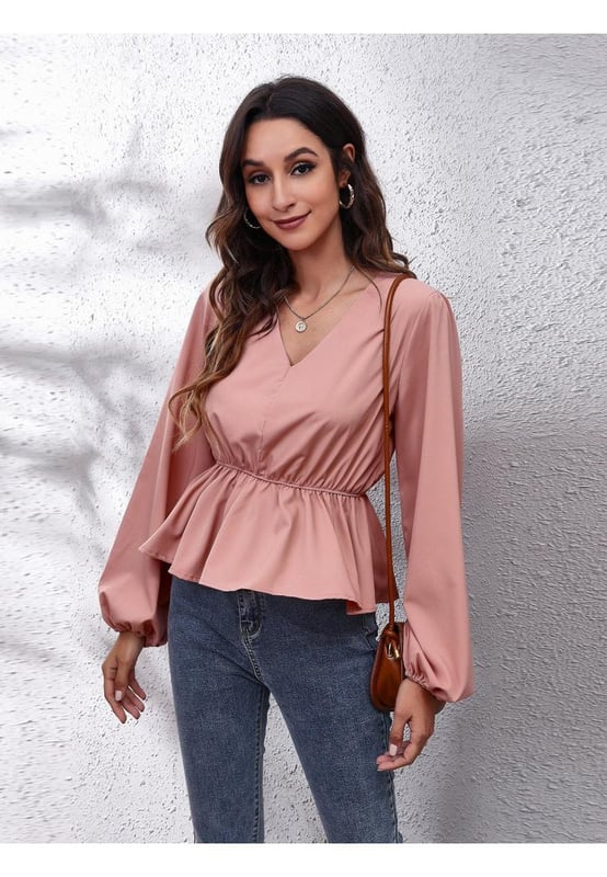 Basic style
  Opaque fabric
  No stretch
  100% polyester
  Machine wash cold
  Tumble dry low
  Imported
  Product measurements:
  S: bust 38.2 in shoulder 14.4 in sleeve length 25 in length 21.5 in
  M: bust 39.8 in shoulder 14.8 in sleeve length 25.4 in length 21.8 in
  L: bust 42.1 in shoulder 15.2 in sleeve length 25.7 in length 22.2 in
  XL: bust 44.5 in shoulder 15.6 in sleeve length 26.1 in length 22.6 in
Material: The material appears to be a lightweight possibly cotton or polyester blend giving it a smooth texture.  The design includes a peplum waistline and long balloon sleeves.