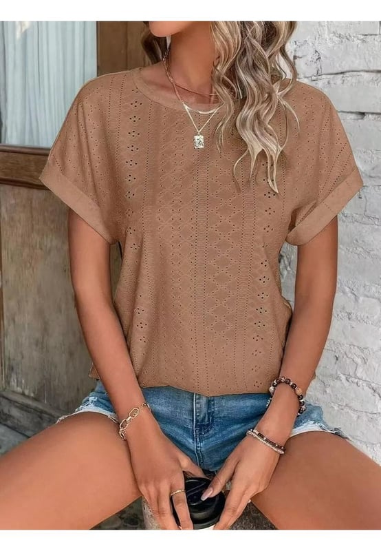 Eyelet Round Neck Short Sleeve Top
  Slightly stretchy fabric
  Material composition: 65% rayon 30% polyester 5% spandex
  Care instructions: Machine wash cold tumble dry low
  Imported
  Available sizes: S (US 4) M (US 6/8) L (US 10/12) XL (US 14/16) 2XL (US 18)
  Top Length: S (26 inches) M (26.4 inches) L (26.8 inches) XL (27.2 inches) 2XL (27.6 inches)
  Bust: S (37 inches) M (39 inches) L (40.9 inches) XL (44.1 inches) 2XL (47.2 inches)
  Sleeve Length: S (8.3 inches) M (8.7 inches) L (9.1 inches) XL (9.8 inches) 2XL (10.6 inches)