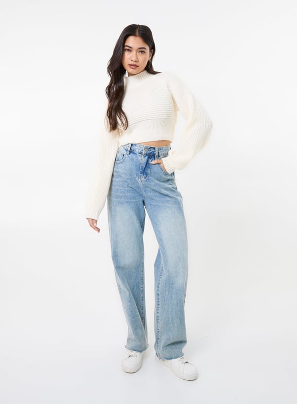 Get cosy this season with this winter weather warmer! Our High Neck Knitted Jumper is the perfect addition to any outfit. Pair with jeans and trainers for the ultimate look.