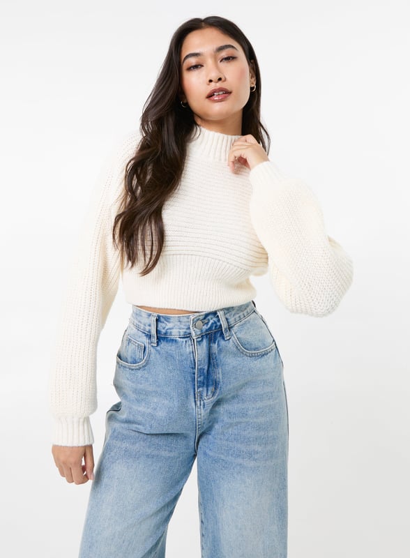Get cosy this season with this winter weather warmer! Our High Neck Knitted Jumper is the perfect addition to any outfit. Pair with jeans and trainers for the ultimate look.