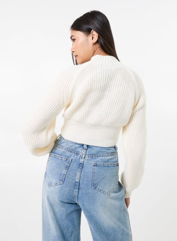 Get cosy this season with this winter weather warmer! Our High Neck Knitted Jumper is the perfect addition to any outfit. Pair with jeans and trainers for the ultimate look.