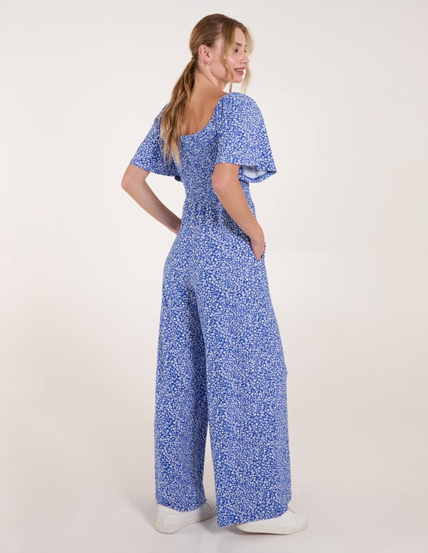 The jumpsuit everyone will be jumping into this season! This cute ditsy print all in one is a must have!
