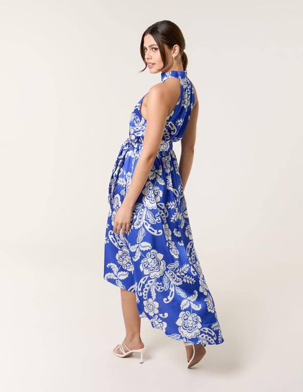 This midi dress is a must-have for special occasions, with it's elegant neckline, satin finish, and wrap front. Team with white heels and silver accessories.     