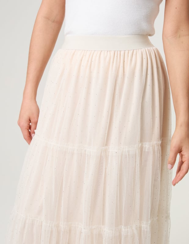 Elevate your wardrobe and feel fabulous in this statement layering tulle skirt. With its elasticated waistband for a comfortable fit, team this skirt with a basic oversized tee and pumps, for a chic kinda look.     
