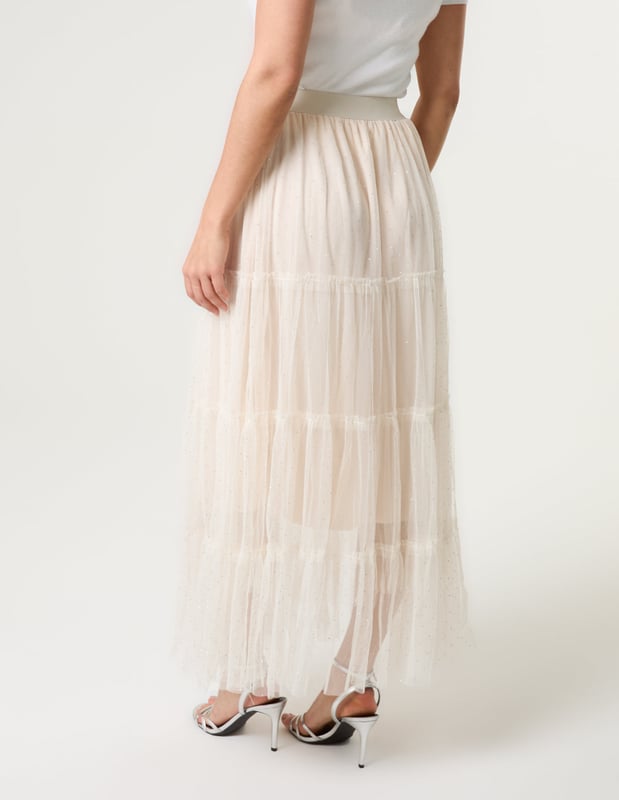 Elevate your wardrobe and feel fabulous in this statement layering tulle skirt. With its elasticated waistband for a comfortable fit, team this skirt with a basic oversized tee and pumps, for a chic kinda look.     