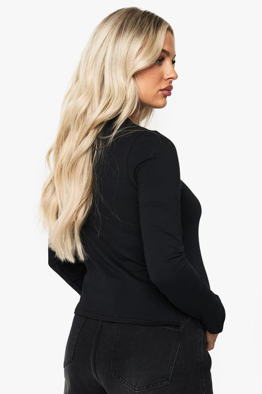 Long-sleeved maternity T-shirt with distinctive split hem design for growing bump accommodation
        Soft cotton fabric provides all-day comfort throughout your pregnancy journey
        Classic crew neckline offers versatile styling options for layering or wearing alone
        Thoughtfully tailored silhouette that grows with you while maintaining a flattering shape
        Curved split hem detail adds contemporary flair to this essential maternity staple
    
    This essential maternity long-sleeved T-shirt combines practicality with style for the fashion-forward mum-to-be. The clever split hem design allows room for your growing bump whilst maintaining a sleek silhouette. Style with wide-leg black denim and trainers for casual weekend brunches, or layer under a chunky cardigan with leggings for relaxed family gatherings. The versatile crew neck makes it perfect for accessorising - add a statement necklace or patterned scarf to refresh your look. For a trendy daytime outfit, pair with an animal print bag as shown for added visual interest. This adaptable cotton top will become your go-to throughout pregnancy, offering comfort without compromising on style - the ultimate wardrobe essential that works across all three trimesters.