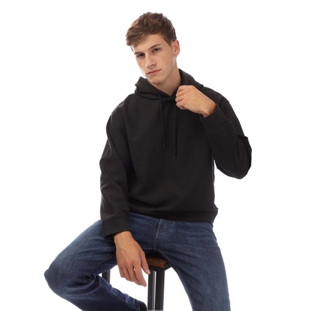 Mens Emporio Armani Allover Lettering Hoodie in black.- Drawstring hood.- Jacquard.- All-over flock print.- Regular fit.- 46% Cotton  46% Lyocell  8% Elastane.- Ref: EM001007AUC001
