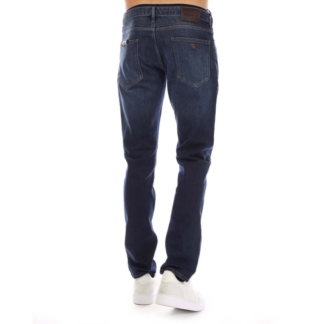 Mens Emporio Armani J06 Slim-Fit Jeans in blue.- Five-pocket styling.- Zip fly and button fastening.- Belt loops.- Leather brand patch.- Slim fit.- 98% Cotton  2% Elastane.- Ref: EM000121AMB002