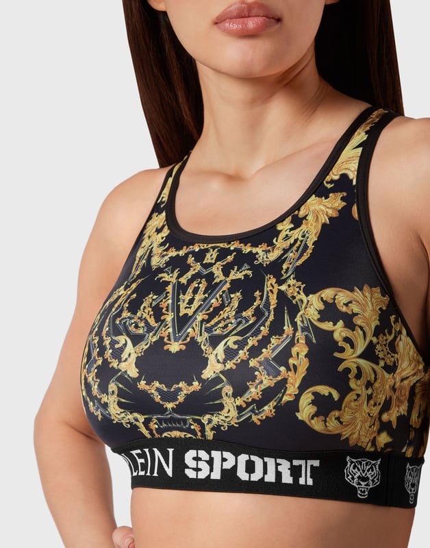 Dale un toque barroco a tu estilo con este bikini de lycra con el estampado de esta temporada por toda la prenda.   Licra con estampado barroco   Espalda cruzada para un movimiento sin restricciones   Acabado con ribete de color en contraste   Parte inferior de corte alto   Jacquard con logotipo tejido en los tirantes elásticos   Costura a dos agujas