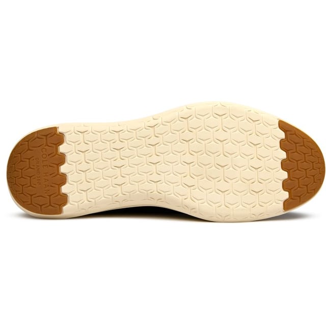 These aren't your typical dress shoes. The Cole Haan Grand Remix Knit combines breathable textile construction with sophisticated leather accents, creating a modern hybrid that works from boardroom to weekend. The innovative FlowerFoam sole delivers exceptional comfort and energy return, while the lightweight design keeps you moving effortlessly through long days. Blue never looked so versatile.