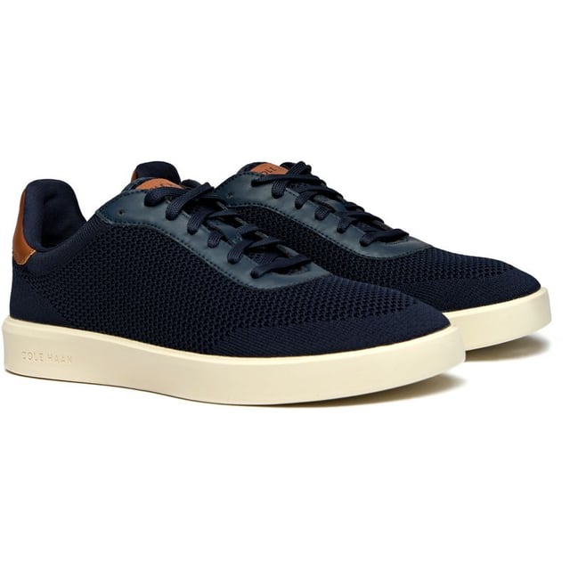 The Cole Haan Grand Court Daily Stitch brings athletic sophistication to your everyday rotation. Crafted with a breathable stitchlite upper in rich blue, these court-inspired trainers blend premium textile construction with serious comfort credentials. The padded collar and plush insole ensure all-day wearability, while the lightweight rubber sole delivers reliable traction whether you're courtside or city-bound. Modern comfort meets timeless style.