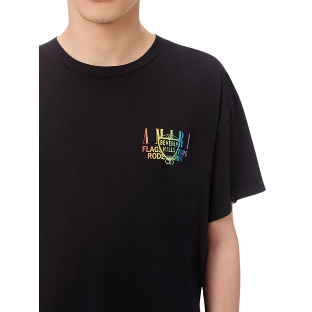 Elevate your wardrobe with the Amiri XO Beverly Hills Black T-Shirt, crafted from 100% premium cotton for exceptional comfort and durability. Made in the USA, this t-shirt combines high-quality materials with expert craftsmanship, ensuring a perfect fit and lasting wear. Its sleek black design and iconic Amiri XO branding make it a versatile piece that effortlessly enhances any casual or streetwear look. Experience the blend of style and comfort that defines luxury with this standout t-shirt, designed for those who appreciate both fashion and quality