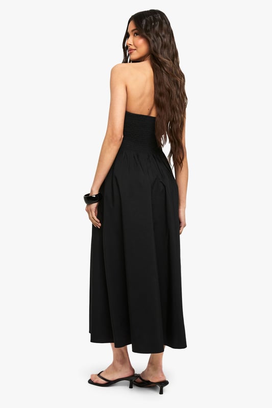 Bandeau Skater Midaxi Dress Elegant bandeau neckline with subtle ruching detail for a flattering silhouette
Fitted bodice transitions into a flowing skater skirt for effortless movement
Midaxi length offers versatile styling options for various occasions
Strapless design showcases shoulders and dcolletage beautifully
Structured woven fabric provides shape retention throughout wear
This bandeau skater midaxi dress from Boohoo combines casual comfort with chic styling. The strapless design creates a fresh summer look that can be dressed up or down depending on the occasion. For daytime outings, style as shown with minimal flat sandals and a compact shoulder bag for an effortlessly cool aesthetic. Add a denim jacket for cooler evenings or layer with a cropped cardigan for family gatherings. The versatile midaxi length works brilliantly for garden parties or casual brunches with friends. For a more polished look, pair with delicate jewellery and a sleek updo. The flowing skater silhouette flatters all body types while offering comfortable movement throughout the day. This wardrobe essential transitions seamlessly from casual daywear to evening drinks with a simple change of accessories.
