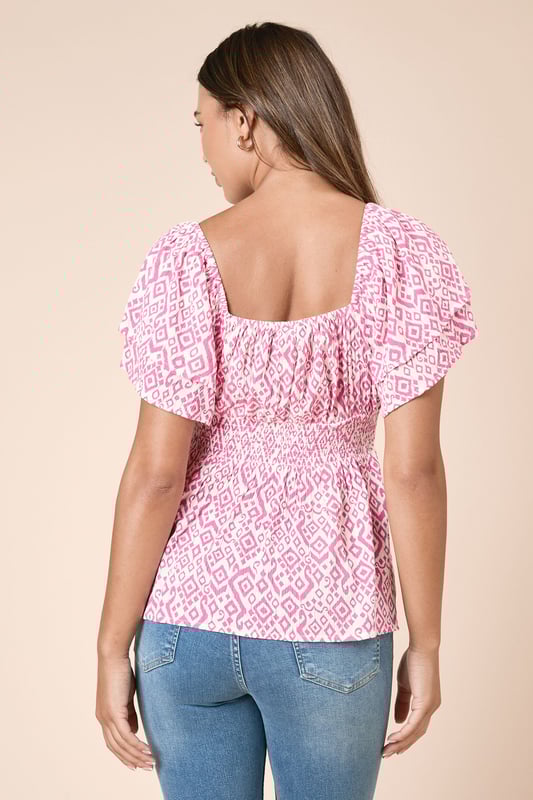 Striking geo print pattern throughout for a distinctive look
        Feminine shirred bodice that flatters your figure
        Delicate frill detail on the short flutter sleeves
        Elegant sweetheart neckline that frames the dcolletage
        Tiered design creates a flowing silhouette with added movement
    
    This charming Dorothy Perkins top combines comfort with style through its beautifully shirred bodice and playful geo print. The feminine flutter sleeves with frill detailing add a touch of romance, while the tiered design creates a flattering shape that works wonderfully for daytime occasions. Style with your favourite skinny jeans and trainers for weekend brunches with friends, or pair with cropped trousers and sandals for family gatherings. The versatile design makes it perfect for baby showers when matched with a denim skirt and delicate jewellery. The lightweight viscose fabric ensures all-day comfort while the shirred detailing accentuates your waist beautifully. This top effortlessly transitions from casual coffee dates to afternoon garden parties with just a simple change of accessories.