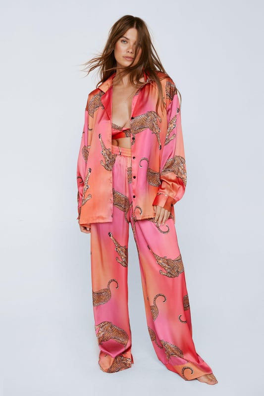 Wild thing. Our satin leopard pajamas are super luxurious, and will have you feeling refreshed come weekend lie-ins. Satin Leopard 3pc Shirt Bralette & Pants PJ Set PJ Shirt, Bralette, & Pants Set Satin Pajamas 3pc Set Long Sleeved Pajama Shirt Button Fastening Oversized Pajama Shirt Satin Bralette Satin Pajama Pants Comfortable High Waist Wide Leg Design Model wears a size M (US size 6/UK size 10).