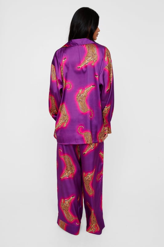 Wild thing. Our satin leopard pajamas are super luxurious, and will have you feeling refreshed come weekend lie-ins. Satin Leopard 3pc Shirt Bralette & Pants PJ Set PJ Shirt, Bralette, & Pants Set Satin Pajamas 3pc Set Long Sleeved Pajama Shirt Button Fastening Oversized Pajama Shirt Satin Bralette Satin Pajama Pants Comfortable High Waist Wide Leg Design Model wears a size M (US size 6/UK size 10).