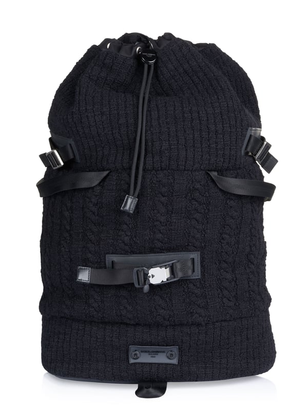 Dolce & Gabbana Duffel bag black 80% Virgin Wool, 10% Calf leather, 8% Polyamide, 2% Acrylic; Dolce & Gabbana duffel bag; Model: BM1904 AW911 8B979; High quality manufactured; Made in Italy; Soft virgin wool blend; One main compartment with drawstring; Two inside compartments, one of which has a zip; Four handles; Two adjustable shoulder straps; Adjustable side straps; Leather details; Silver-coloured metal details; Dimensions (cm): 64 x 40 x 21; Dolce & Gabbana logo details