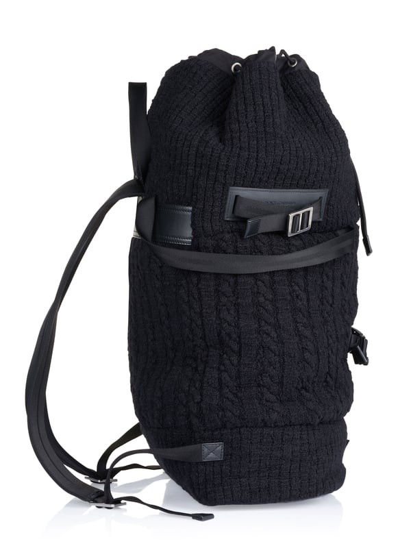 Dolce & Gabbana Duffel bag black 80% Virgin Wool, 10% Calf leather, 8% Polyamide, 2% Acrylic; Dolce & Gabbana duffel bag; Model: BM1904 AW911 8B979; High quality manufactured; Made in Italy; Soft virgin wool blend; One main compartment with drawstring; Two inside compartments, one of which has a zip; Four handles; Two adjustable shoulder straps; Adjustable side straps; Leather details; Silver-coloured metal details; Dimensions (cm): 64 x 40 x 21; Dolce & Gabbana logo details