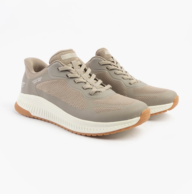 This women's fitness trainer features a synthetic and mesh upper with air-cooled memory foam for comfort. The low-top design with a rubber sole offers relaxed fit and easy slip-in wear