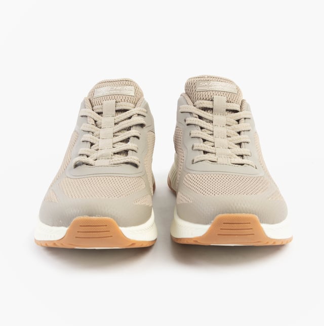 This women's fitness trainer features a synthetic and mesh upper with air-cooled memory foam for comfort. The low-top design with a rubber sole offers relaxed fit and easy slip-in wear
