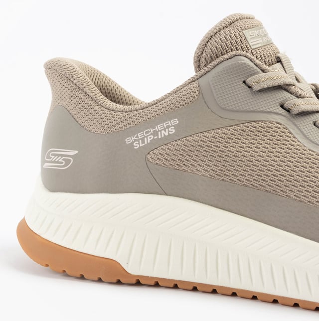 This women's fitness trainer features a synthetic and mesh upper with air-cooled memory foam for comfort. The low-top design with a rubber sole offers relaxed fit and easy slip-in wear
