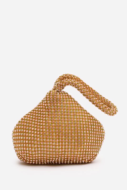 Add sparkle to your night with this Cascabel mini chainmail pouch bag, designed to dazzle at parties, weddings, or festive occasions. Its compact silhouette features shimmering crystal-style embellishments and a stylish knotted wristlet strap for easy carrying. Lightweight yet eye-catching, it's the perfect accessory for carrying your small essentials in glamorous style. A chic statement piece that blends retro charm with modern flair. Key Features: • Material: Rhinestone-embellished chainmail mesh • Dimensions: 16cm (L) x 14cm (H) x 10cm (W) • Fastening: Hidden zip closure at the top • Detail: Knotted wristlet strap for a secure and stylish hold