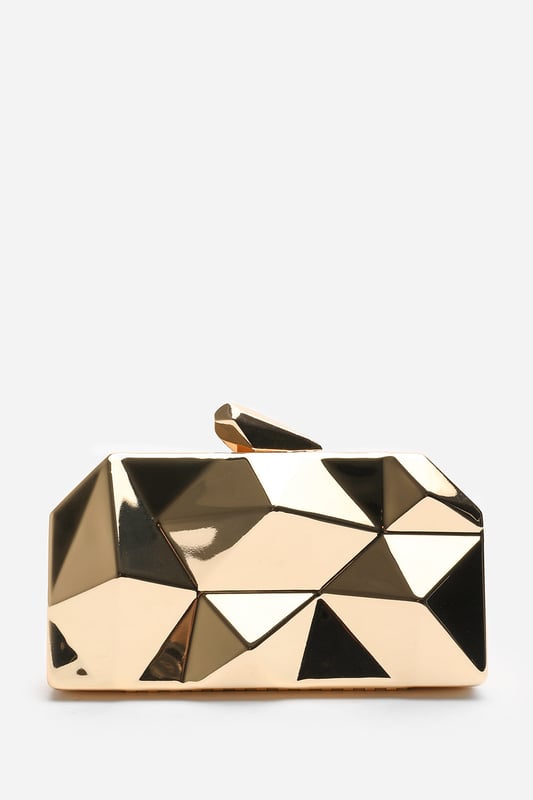 Turn heads with this striking Rica geometric clutch bag, designed to make a bold fashion statement at any evening event. The angular, high-gloss surface creates a modern 3D effect that reflects light from every angle. Its compact hard case keeps essentials secure while offering standout style. Perfect for weddings, parties, or night outs. Key Features: • Material: High-shine acrylic hard case with faceted geometric design • Dimensions: 18cm (L) x 9cm (H) x 6cm (W) • Fastening: Top snap clasp closure • Detail: Unique polygonal surface with a sculptural silhouette