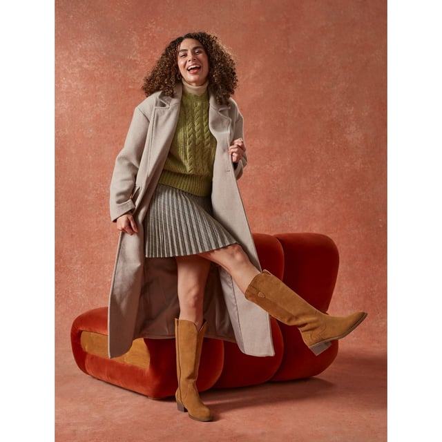 Hush Puppies Isabella Suede Women's Tan Heeled Knee High Boots Embrace the cowboy trends with the Isabella long boot, crafted in real suede with Western-inspired buckle detail and a comfy block heel. Seriously cosy, they're the perfect partner for Winter adventures with our WorryFree water repellent tech.