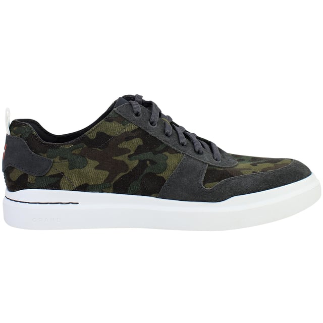 Bold yet refined, the Cole Haan GrandPrø Rally Men’s Trainers in Camo Green fuse athletic performance with elevated street style. With lightweight construction, cushioned comfort, and a distinctive camouflage print, these trainers are made for men who move confidently between work, play, and everything in between.
Key Features
Lightweight EVA Midsole

Engineered for soft, responsive cushioning and a featherlight feel ideal for all-day wear.

Classic Low-Top Sneaker Silhouette

Inspired by court heritage with a clean, modern twist that fits seamlessly into casual or smart-casual wardrobes.

Ortholite® Footbed

Provides moisture-wicking, breathable support and long-lasting underfoot comfort.

Durable Rubber Outsole with Traction Pods

Delivers stability, grip, and flexibility for versatile movement across everyday surfaces.

Secure Lace-Up Closure

Offers a snug, adjustable fit while maintaining a streamlined look.

Padded Collar and Tongue

Enhance ankle comfort and support, whether you’re on the move or on your feet all day.

Camo Green Colourway

Subtle yet statement-making—pairs easily with denim, joggers, or tapered trousers.


From city streets to casual weekends, the Cole Haan GrandPrø Rally Men’s Camo Green Trainers deliver modern comfort and confident style—crafted for everyday versatility with a bold edge.