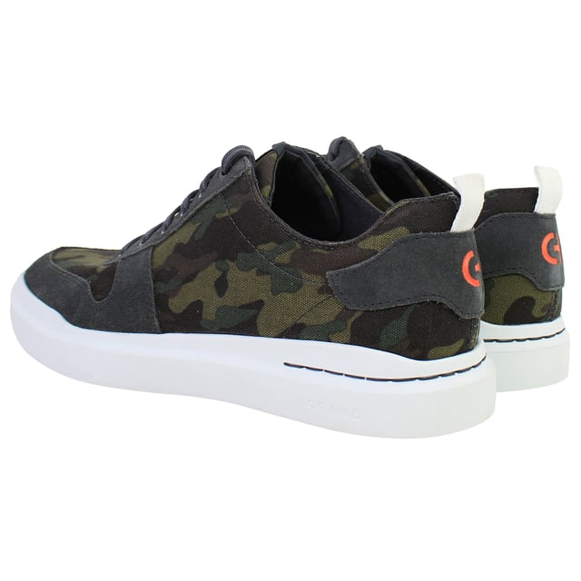 Bold yet refined, the Cole Haan GrandPrø Rally Men’s Trainers in Camo Green fuse athletic performance with elevated street style. With lightweight construction, cushioned comfort, and a distinctive camouflage print, these trainers are made for men who move confidently between work, play, and everything in between.
Key Features
Lightweight EVA Midsole

Engineered for soft, responsive cushioning and a featherlight feel ideal for all-day wear.

Classic Low-Top Sneaker Silhouette

Inspired by court heritage with a clean, modern twist that fits seamlessly into casual or smart-casual wardrobes.

Ortholite® Footbed

Provides moisture-wicking, breathable support and long-lasting underfoot comfort.

Durable Rubber Outsole with Traction Pods

Delivers stability, grip, and flexibility for versatile movement across everyday surfaces.

Secure Lace-Up Closure

Offers a snug, adjustable fit while maintaining a streamlined look.

Padded Collar and Tongue

Enhance ankle comfort and support, whether you’re on the move or on your feet all day.

Camo Green Colourway

Subtle yet statement-making—pairs easily with denim, joggers, or tapered trousers.


From city streets to casual weekends, the Cole Haan GrandPrø Rally Men’s Camo Green Trainers deliver modern comfort and confident style—crafted for everyday versatility with a bold edge.