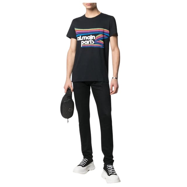Elevate your wardrobe with the Balmain Paris Rainbow Multi Logo Black T-Shirt, a striking blend of luxury and casual style. Crafted from 100% premium cotton in Portugal, this black tee offers exceptional comfort and durability. The vibrant rainbow multi-logo design adds a bold, contemporary edge, making it perfect for those who want to stand out effortlessly. Whether paired with jeans or layered under a jacket, this Balmain T-shirt brings a touch of Parisian sophistication to your everyday look. Experience the perfect fusion of quality and fashion with this must-have piece