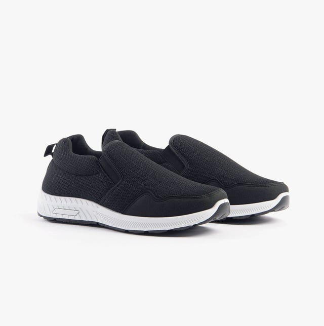 These wide-fit men's trainers feature a textile upper and lining with a rubber sole, offering comfort and breathability. Ideal for casual wear with a low-top slip-on design
