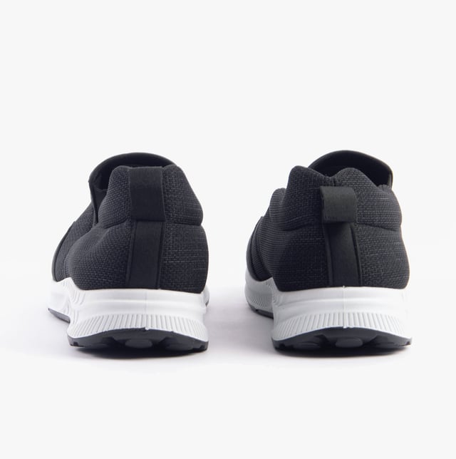 These wide-fit men's trainers feature a textile upper and lining with a rubber sole, offering comfort and breathability. Ideal for casual wear with a low-top slip-on design