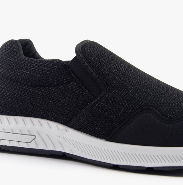 These wide-fit men's trainers feature a textile upper and lining with a rubber sole, offering comfort and breathability. Ideal for casual wear with a low-top slip-on design