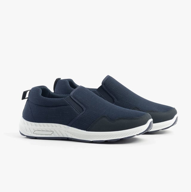 These wide-fit men's trainers feature a textile upper and lining with a rubber sole, offering comfort and breathability. Ideal for casual wear with a low-top design and slip-on closure