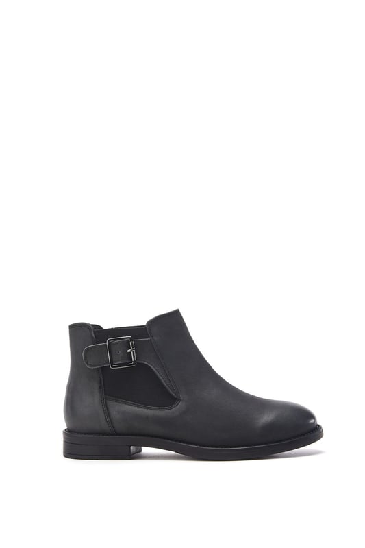 Put your best foot forward in Bryana, the leather flat ankle boot. This style features a buckle design with an elastic panel for easy foot entry. Bryana is the wardrobe essential must-have for this season.