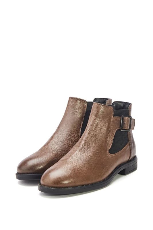 Put your best foot forward in Bryana, the leather flat ankle boot. This style features a buckle design with an elastic panel for easy foot entry. Bryana is the wardrobe essential must-have for this season.