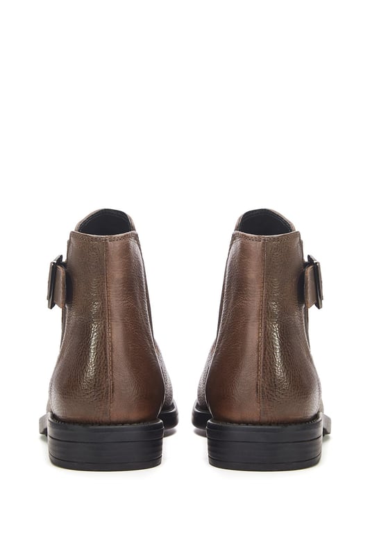 Put your best foot forward in Bryana, the leather flat ankle boot. This style features a buckle design with an elastic panel for easy foot entry. Bryana is the wardrobe essential must-have for this season.