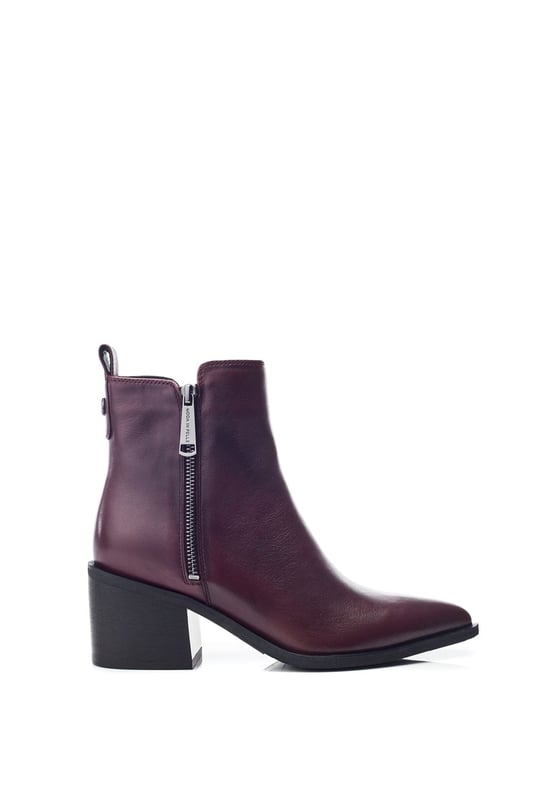 Perfect your look in Perth, the classic ankle boot combining simplicity and sophistication. This style features a pointed toe design with a zip fastening for effortless foot entry and a block heel for added height.