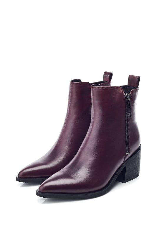 Perfect your look in Perth, the classic ankle boot combining simplicity and sophistication. This style features a pointed toe design with a zip fastening for effortless foot entry and a block heel for added height.