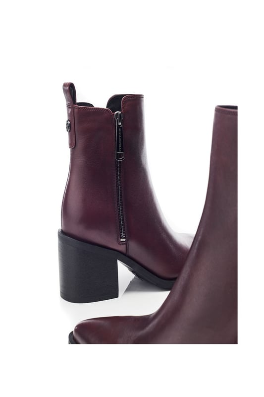 Perfect your look in Perth, the classic ankle boot combining simplicity and sophistication. This style features a pointed toe design with a zip fastening for effortless foot entry and a block heel for added height.