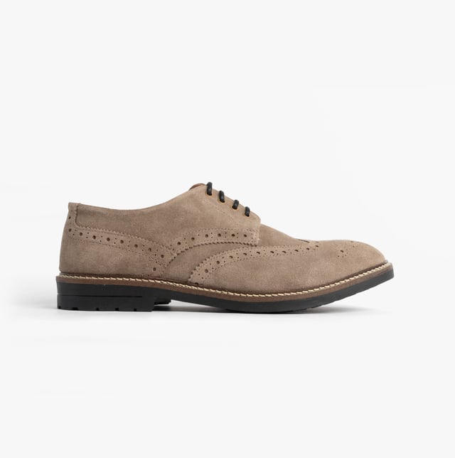 These beige brogue shoes feature a suede upper, textile lining, rubber sole, and lace-up closure. Designed for comfort, they are suitable for formal occasions and low-top style